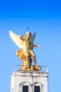 Roman statue on the top of church