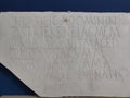 Roman stone slab with inscriptions one part Royalty Free Stock Photo