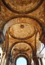 Roman style ceiling in yellow bricks with roman column pillars