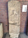 Roman tombstone human figure and text Sremska Mitrovica Serbia