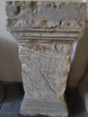 Roman tombstone with latin text carved on the front side