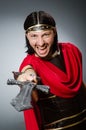 The roman warrior with sword against background Royalty Free Stock Photo
