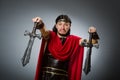 The roman warrior with sword against background Royalty Free Stock Photo