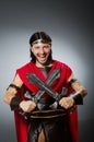 The roman warrior with sword against background Royalty Free Stock Photo