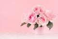 Romance celebration flowers background - pink luxury roses bouquet on white wood board, copy space.