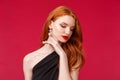 Romance, elegance, beauty and women concept. Close-up portrait of seductive, sensual and feminine redhead adult woman in