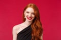 Romance, elegance, beauty and women concept. Elegant good-looking redhead woman in black stylish dress feeling hot and