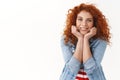 Romance, emotions, wellbeing concept. Happy tender feminine ginger woman 25s curly hairstyle dreaming charming vacation