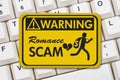 Romance Scam warning sign on a keyboard Royalty Free Stock Photo