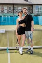 romance on tennis court, positive couple Royalty Free Stock Photo