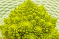 romanesco broccoli roman cauliflower inflorescence head of fresh green cabbage fractal exotic vegetable background Royalty Free Stock Photo