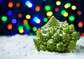 romanescu broccoli on colored bokeh background