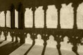 Romanesque arcade with columns and shadows in Olite. Navarra, Sp