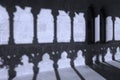 Romanesque arcade with columns and shadows in Olite. Navarra, Sp