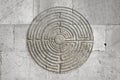 Romanesque labyrinth carved on a stone wall - concept image