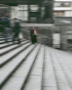 Romani woman standing in a blurred vision of city life. Royalty Free Stock Photo