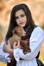 Romania beautiful girl with lamb and traditional costume