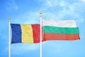 Romania and Bulgaria two flags on flagpoles and blue sky