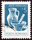 ROMANIA - CIRCA 1982: A stamp printed in Romania shows Ceramic bowl and pot from Marginea, Suceava, circa 1982.