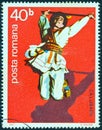 ROMANIA - CIRCA 1977: A stamp printed in Romania shows leaping dancer with stick, circa 1977.