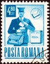 ROMANIA - CIRCA 1971: A stamp printed in Romania shows postman on round, circa 1971. Royalty Free Stock Photo