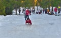 Romania, crowds of tourists and fun on the snow slopes, the joy of sledding on the snow.