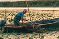 ROMANIA, DANUBE DELTA, AUGUST 2019: Fisherman throwing the smallest fish back into the water Royalty Free Stock Photo