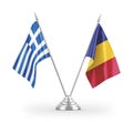 Romania and Greece table flags isolated on white 3D rendering