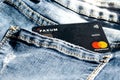 Romania -May 17,,2020 : Paxum plastic card in the back pocket of jeans . Concept of savings, during the financial crisis or card