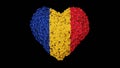 Romania. National Day. 1 December. Great Union Day. Heart shape made out of flowers on black background. Royalty Free Stock Photo