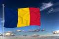 Romania national flag waving in the wind against deep blue sky.  International relations concept Royalty Free Stock Photo