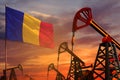 Romania oil industry concept. Industrial illustration - Romania flag and oil wells with the red and blue sunset or sunrise sky Royalty Free Stock Photo