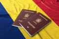 Romania passport on the Romanian flag, Romanian passport is an international travel document issued to nationals of Romania Royalty Free Stock Photo
