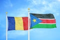 Romania and South Sudan two flags on flagpoles and blue sky