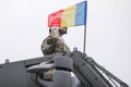 Romanian army soldier salutes the crowd during the Romanian National Day military parade