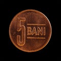 Romanian 5 Bani coin isolated on a black background