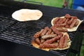 Romanian barbecue mici with pita bread Royalty Free Stock Photo