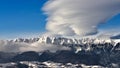 Romanian Carpathian mountain in winter time with clouds and clear sky Royalty Free Stock Photo