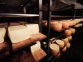 Romanian cheese Nasal on metal shelves in the grotto