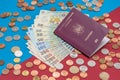 Romanian concept. The Romanian passport and Romanian banknotes/coins on a blue and red background. Coloseup of Romanian Passport Royalty Free Stock Photo