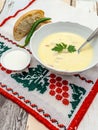 Romanian dish ciorba de burta or tripe soup served with hot pepper and sour cream