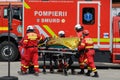 Romanian first responders, firefighters and paramedics, train to extricate and save the victim of a motorcycle accident during a Royalty Free Stock Photo