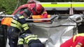 Romanian first responders train to extricate and save the victim of a car accident during a drill exercise.