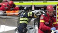 Romanian first responders train to extricate and save the victim of a car accident during a drill exercise.