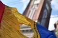 Romanian flag with the communist coat of arms cut out