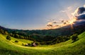 Romanian hillside and village in summer time , mountain landscape of Transylvania in Romania