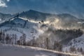 Romanian hillside and village in winter time , mountain landscape of Transylvania in Romania