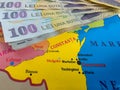 Romanian 100 Lei banknotes on a map of Romanian Counties focused on Constanta Royalty Free Stock Photo