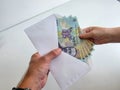 Romanian Lei 100 RON bank notes in an envelope Royalty Free Stock Photo