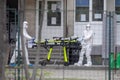 Romanian medical personnel wearing protective suits in the yard of a hospital closed for Covid-19 infection